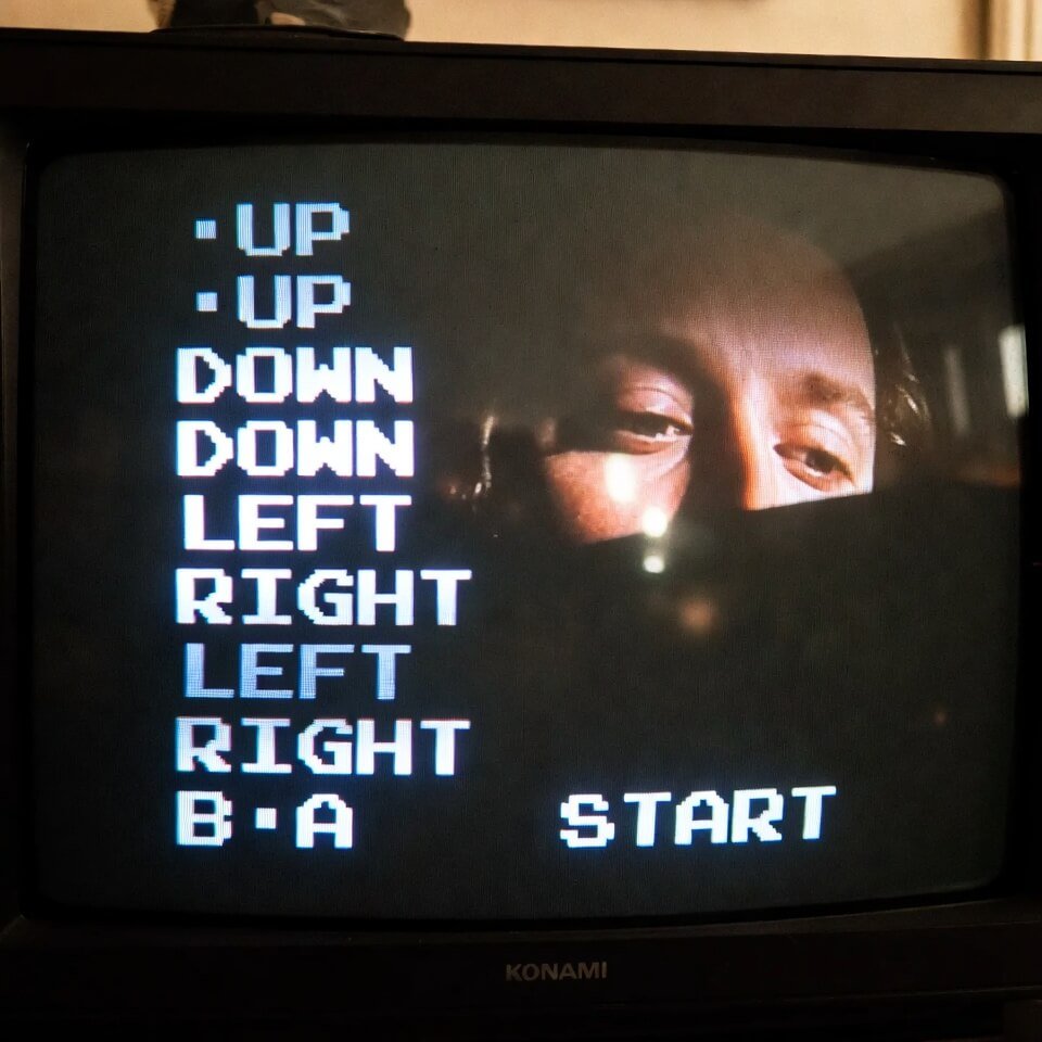 Tired reflection on CRT screen with Konami code