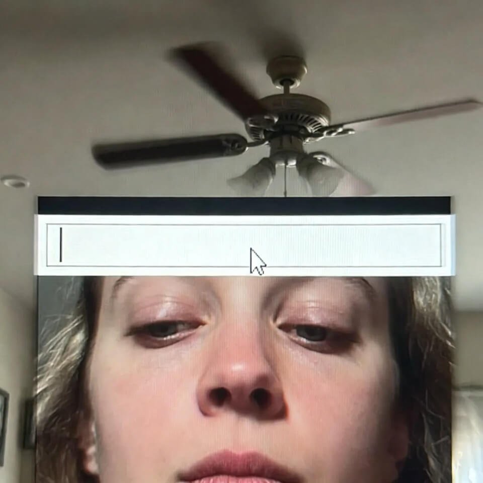 Tired eyes reflecting in screen with search bar asterisk
