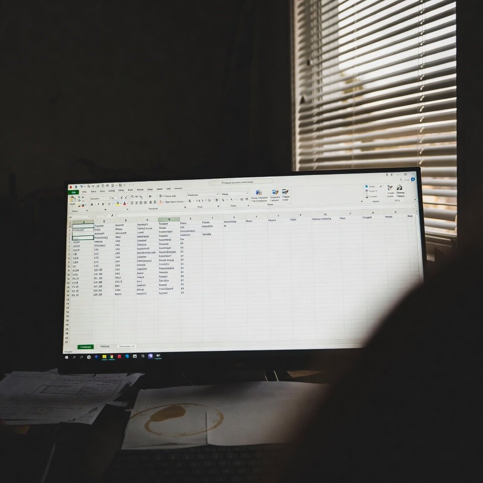 Low-angle view of coffee-stained Excel sheet from ChatGPT